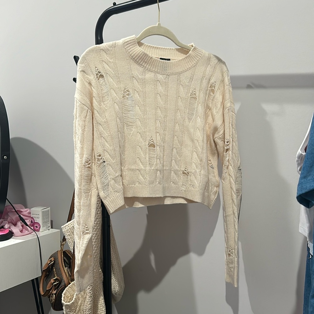 Distressed cropped sweater